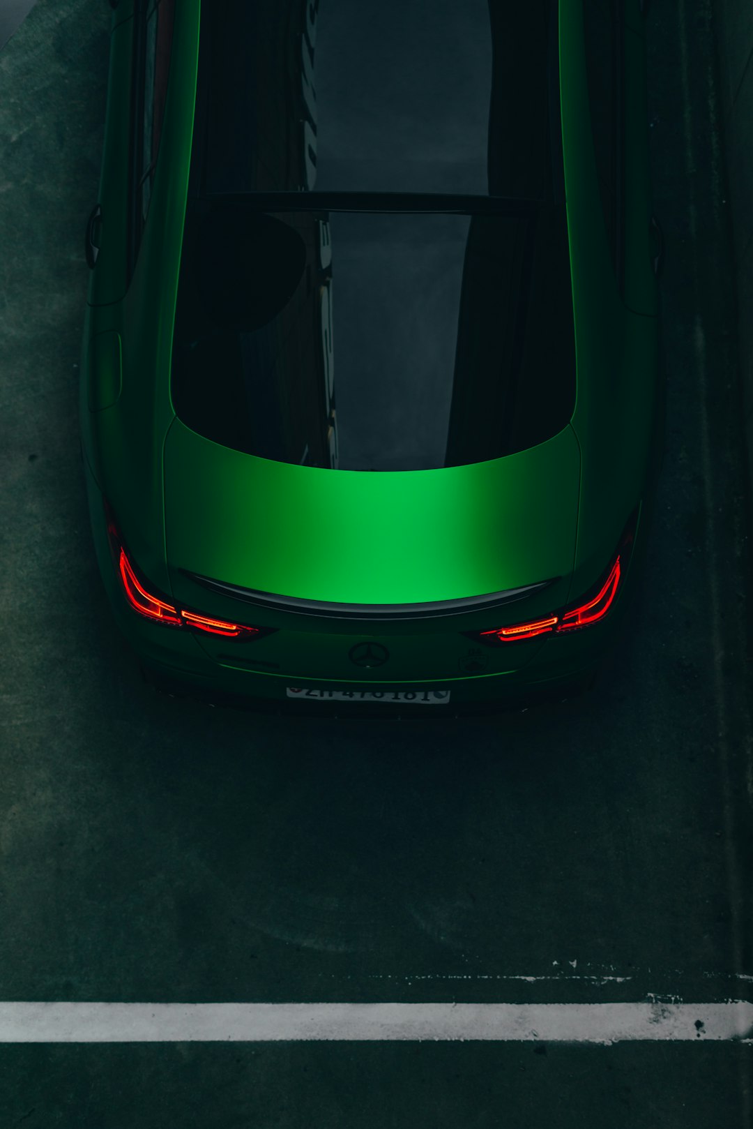 About a-green-sports-car-parked-in-a-parking-lot-sdelnts79cq